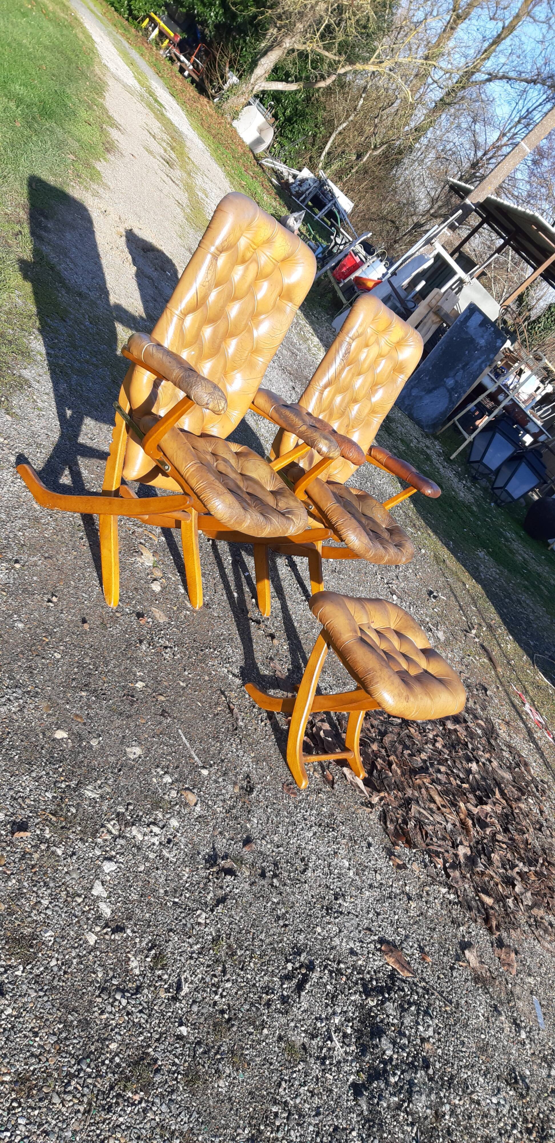 Pair of chesterfield style leather armchairs