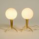 Two Mid-Century Modern rocket table lamps in brass and glass