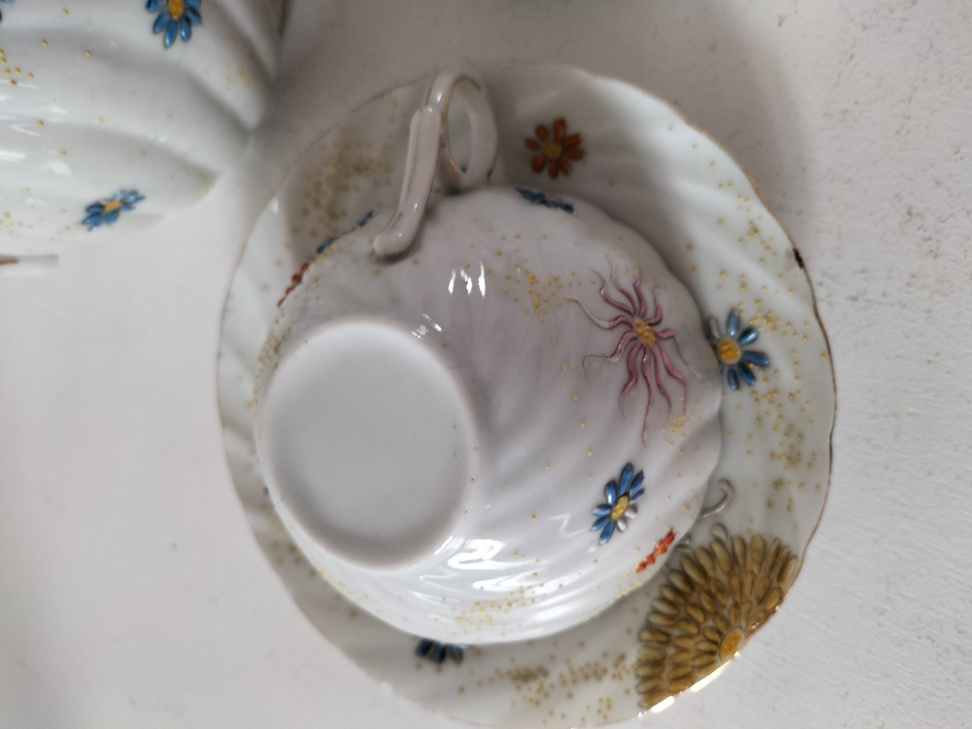 coffee pot, cup and saucers