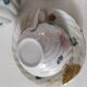 coffee pot, cup and saucers