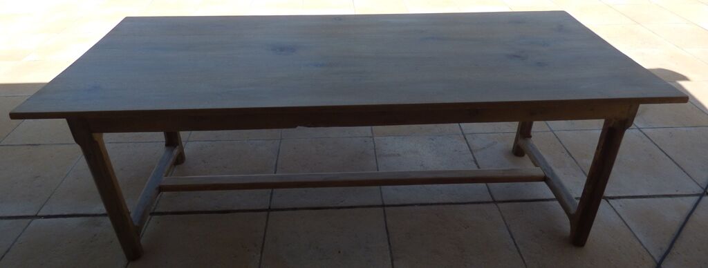 Large honey-colored farmhouse table in solid oak