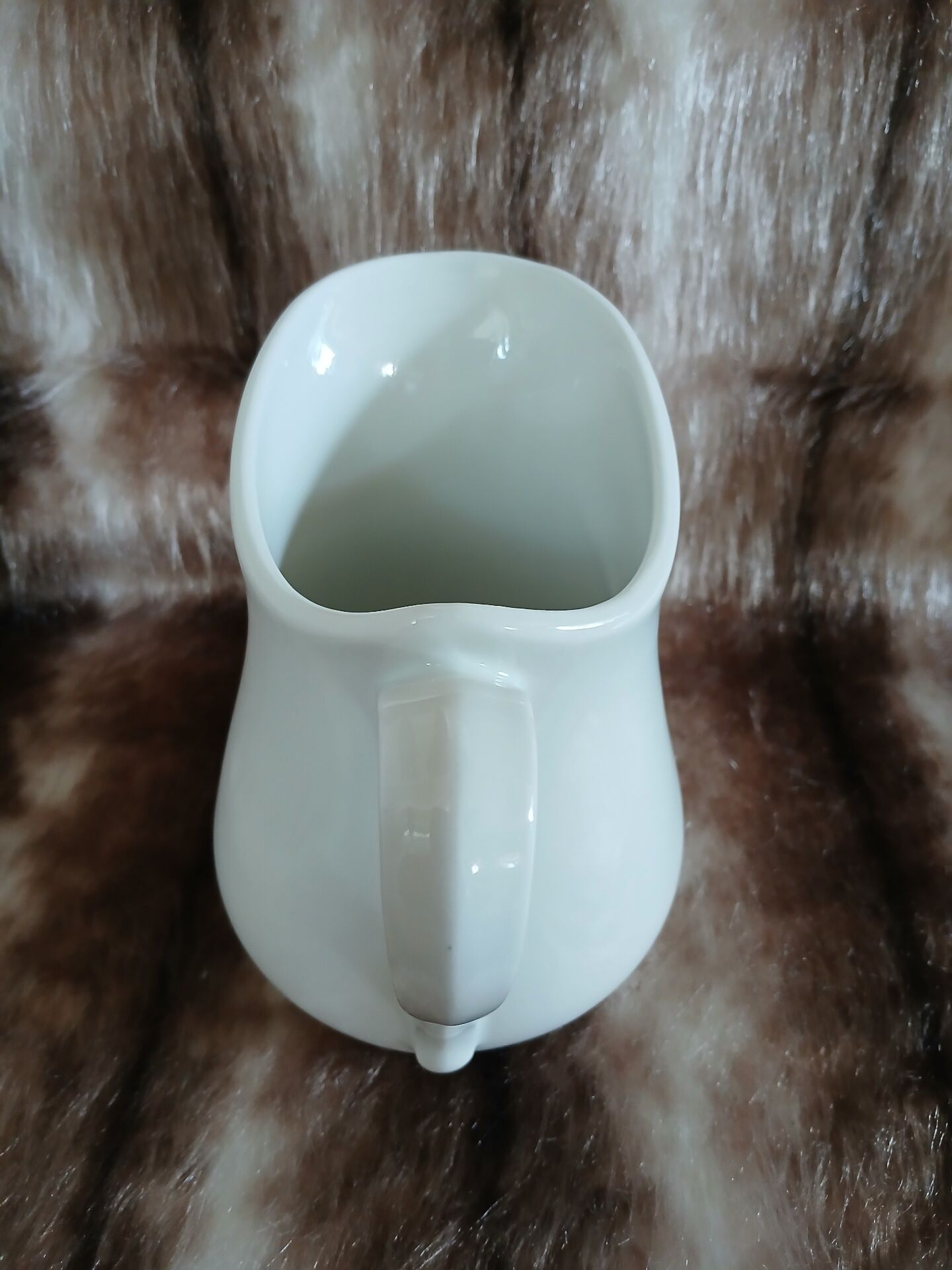 2 antique pitchers in white earthenware