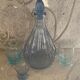 Liquor service consisting of a blue glass decanter and. 3 small antique glasses