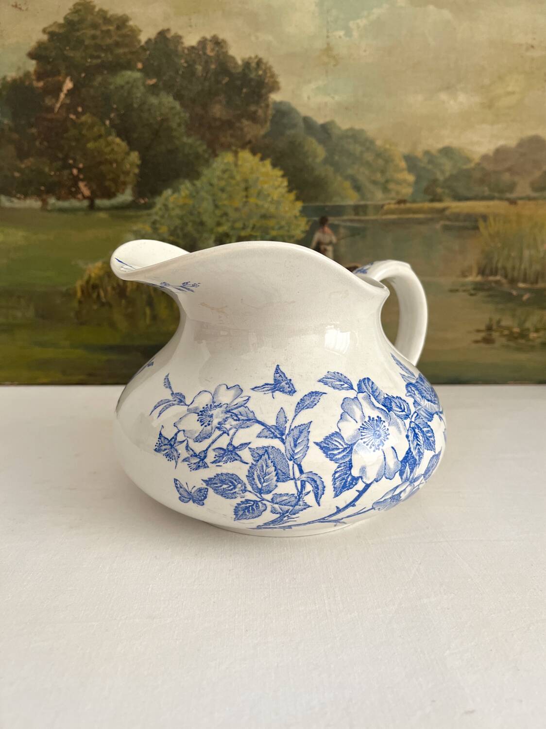 Antique chubby ironstone jug with floral and bird decoration