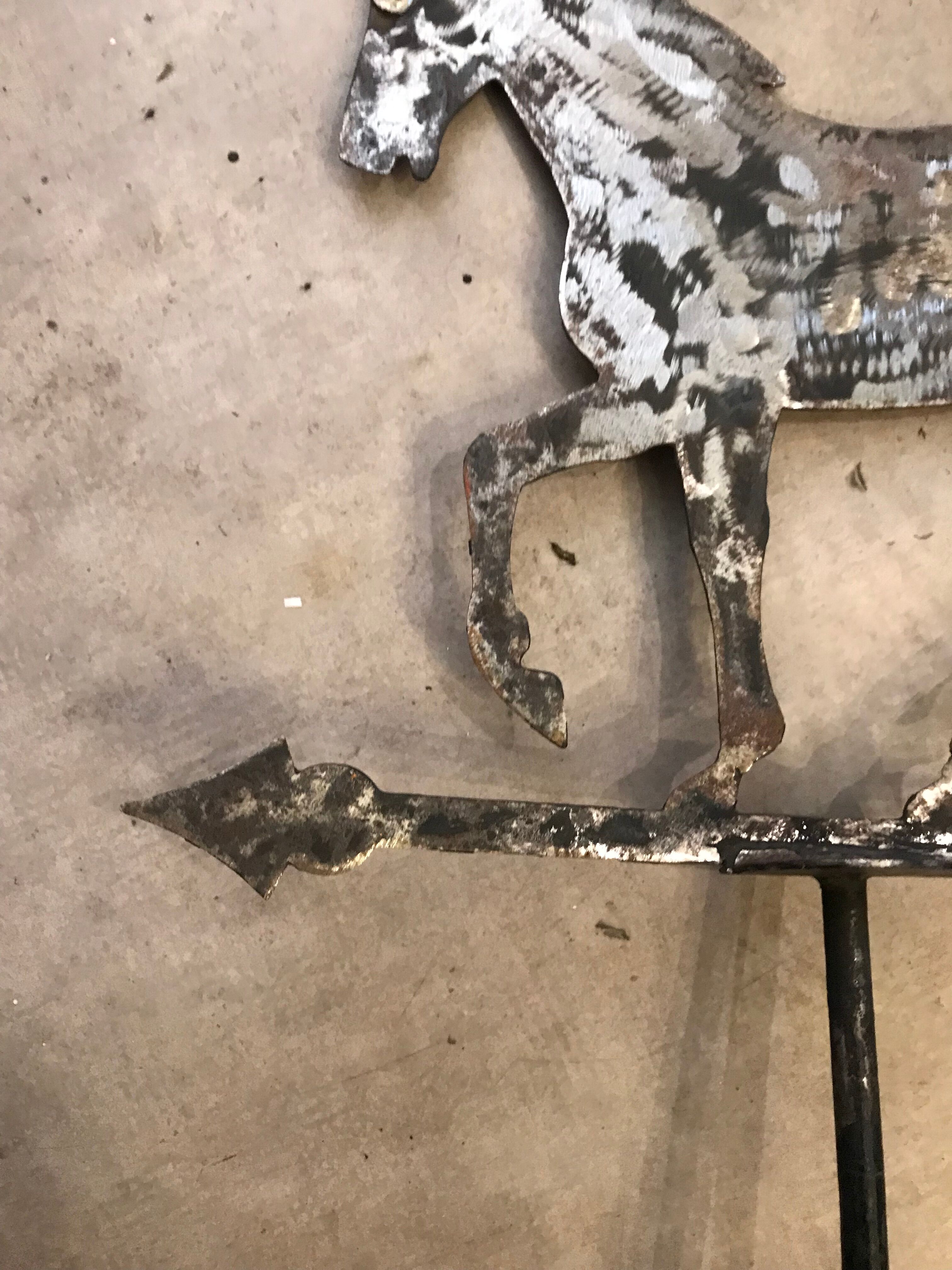 Horse-shaped weather vane in brushed steel artisanal work by ironworker