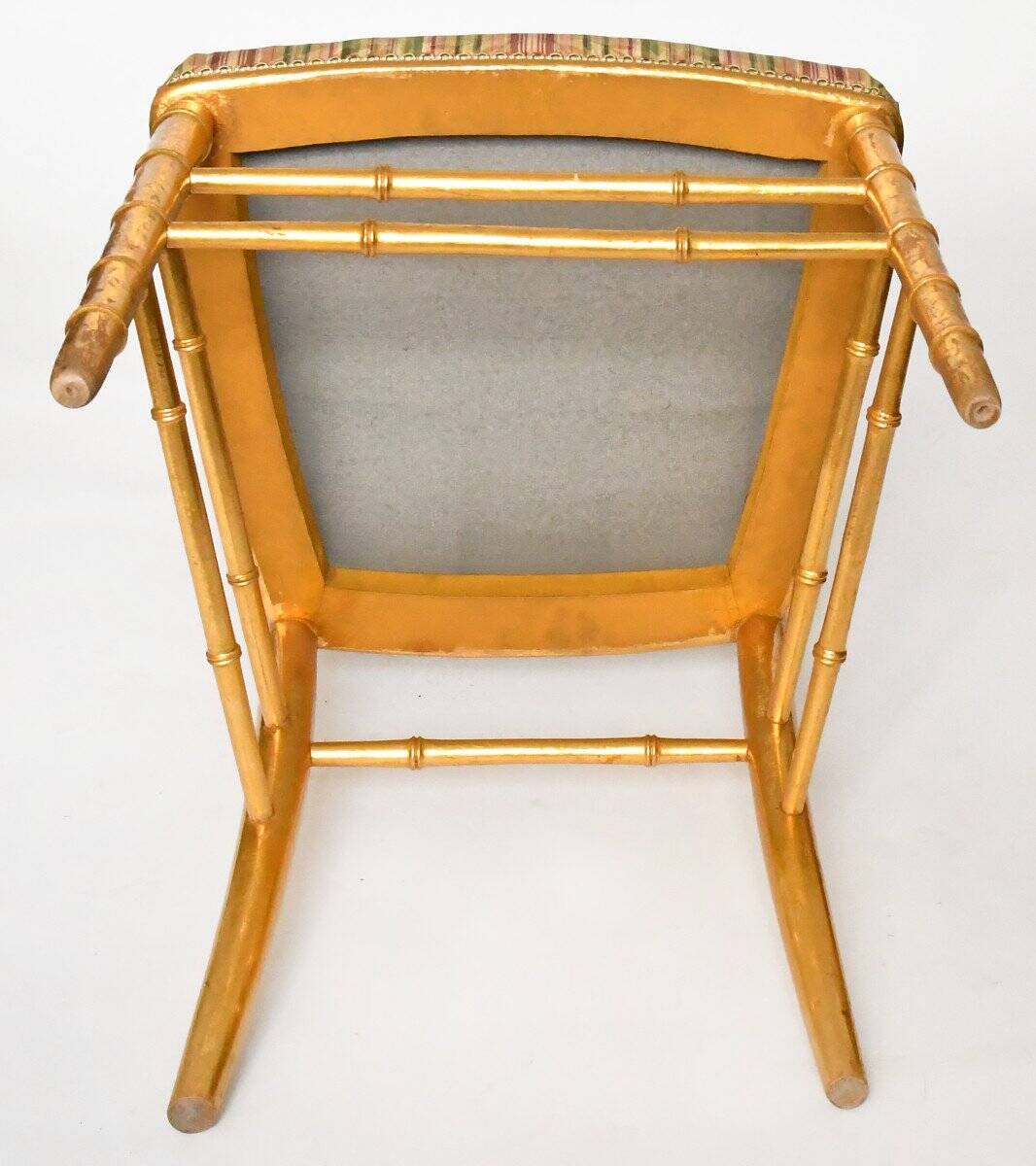 Pair of golden wood chairs in a bamboo style.
