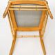 Pair of golden wood chairs in a bamboo style.
