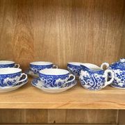 Japanese porcelain service with lithophany, blue and white floral decorations.