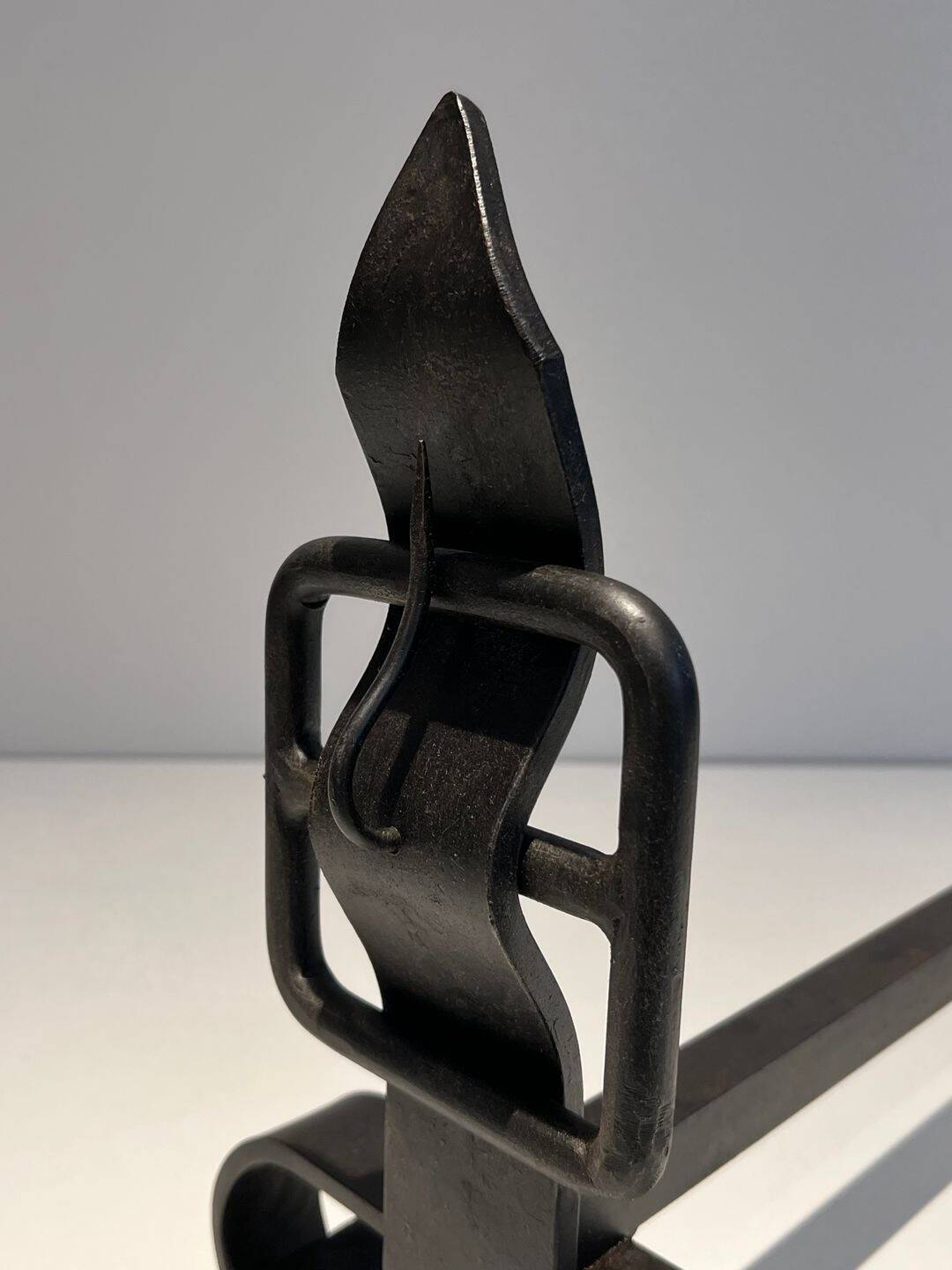 Pair of Wrought Iron Andirons with Obelisk and Belt Motifs