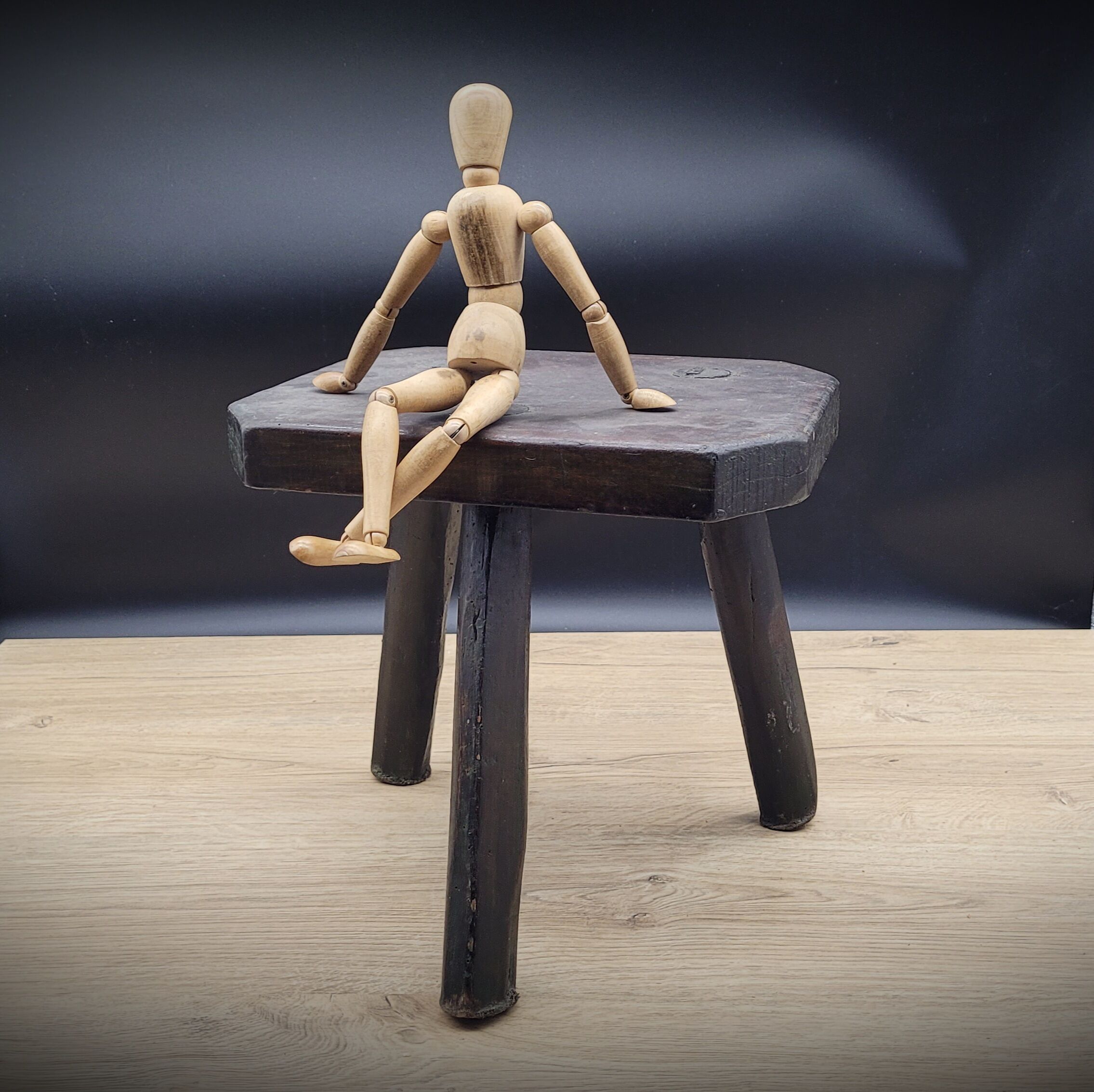 Dark octagon tripod stool