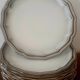 Service of 12 flat plates Salins France, taupe rim.