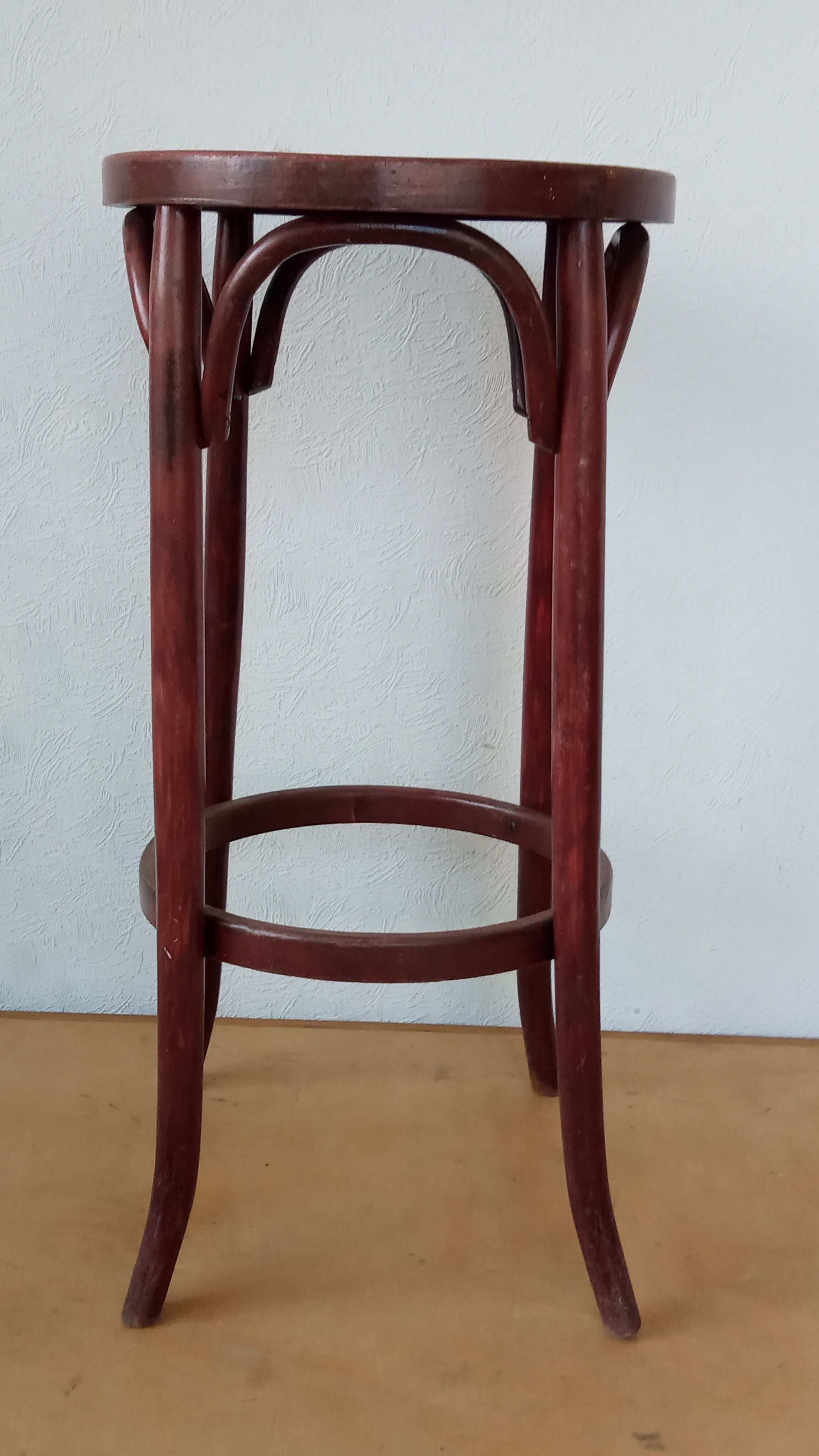 Curved wooden bar stool