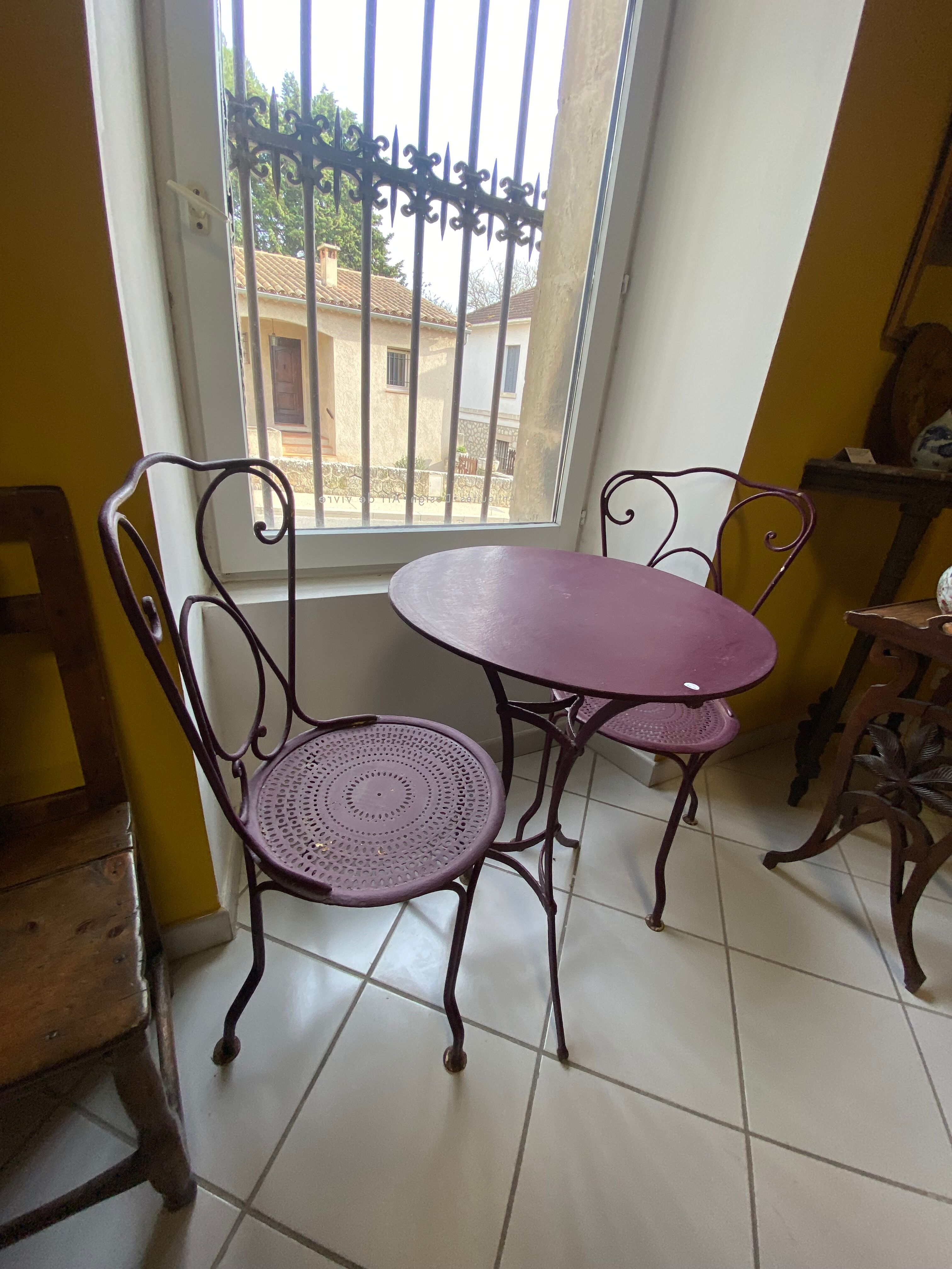 Set of two chairs and wrought iron pedestal table
