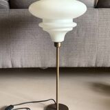 Table lamp with a matte white glass globe