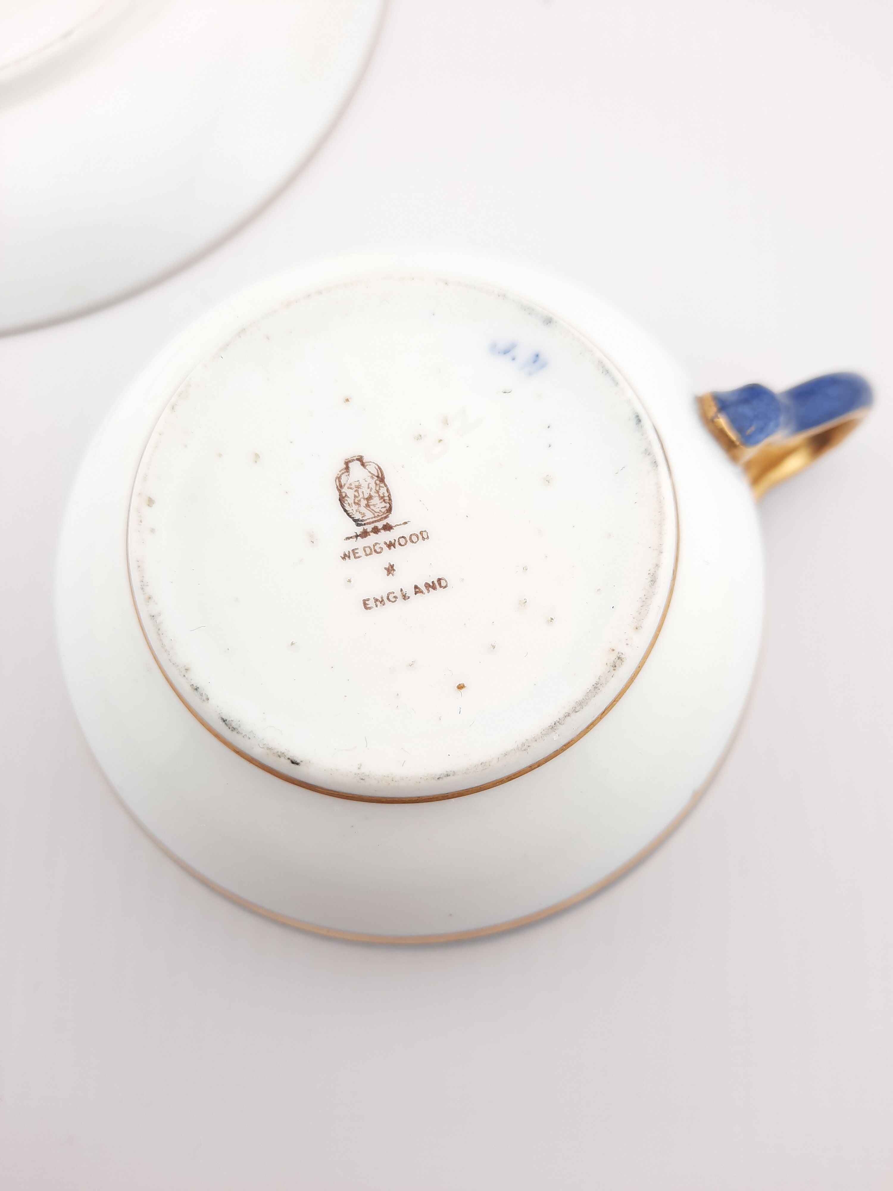 Antique Wedgwood teacup and saucer, bone china. Powder blue and gold English cup and saucer, 1900s