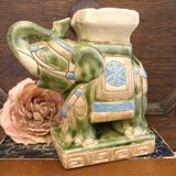 Small green ceramic elephant vase