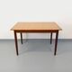 Rectangular dining table in vintage Scandinavian style made of teak and melamine.