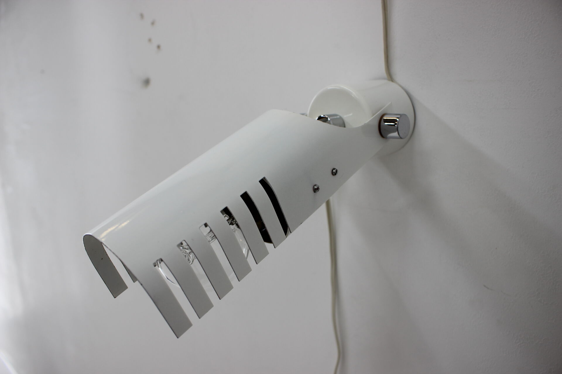 Set of three white adjustable design wall lamp, 1980's.