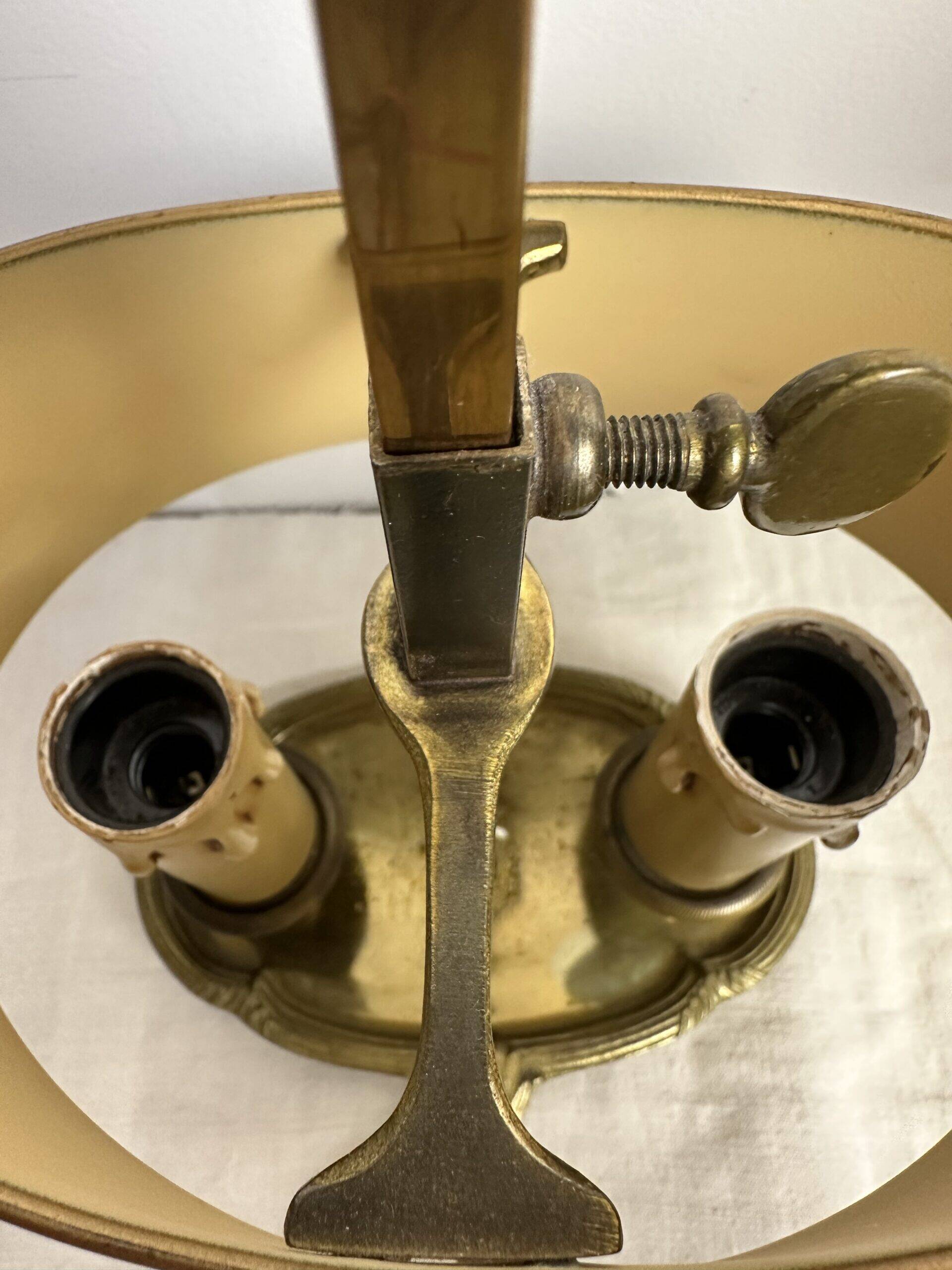 A pair of old brass bed warmers.