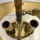 A pair of old brass bed warmers.