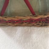 Bottle sheathed on the top and the low d wicker woven