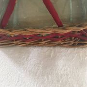Bottle sheathed on the top and the low d wicker woven