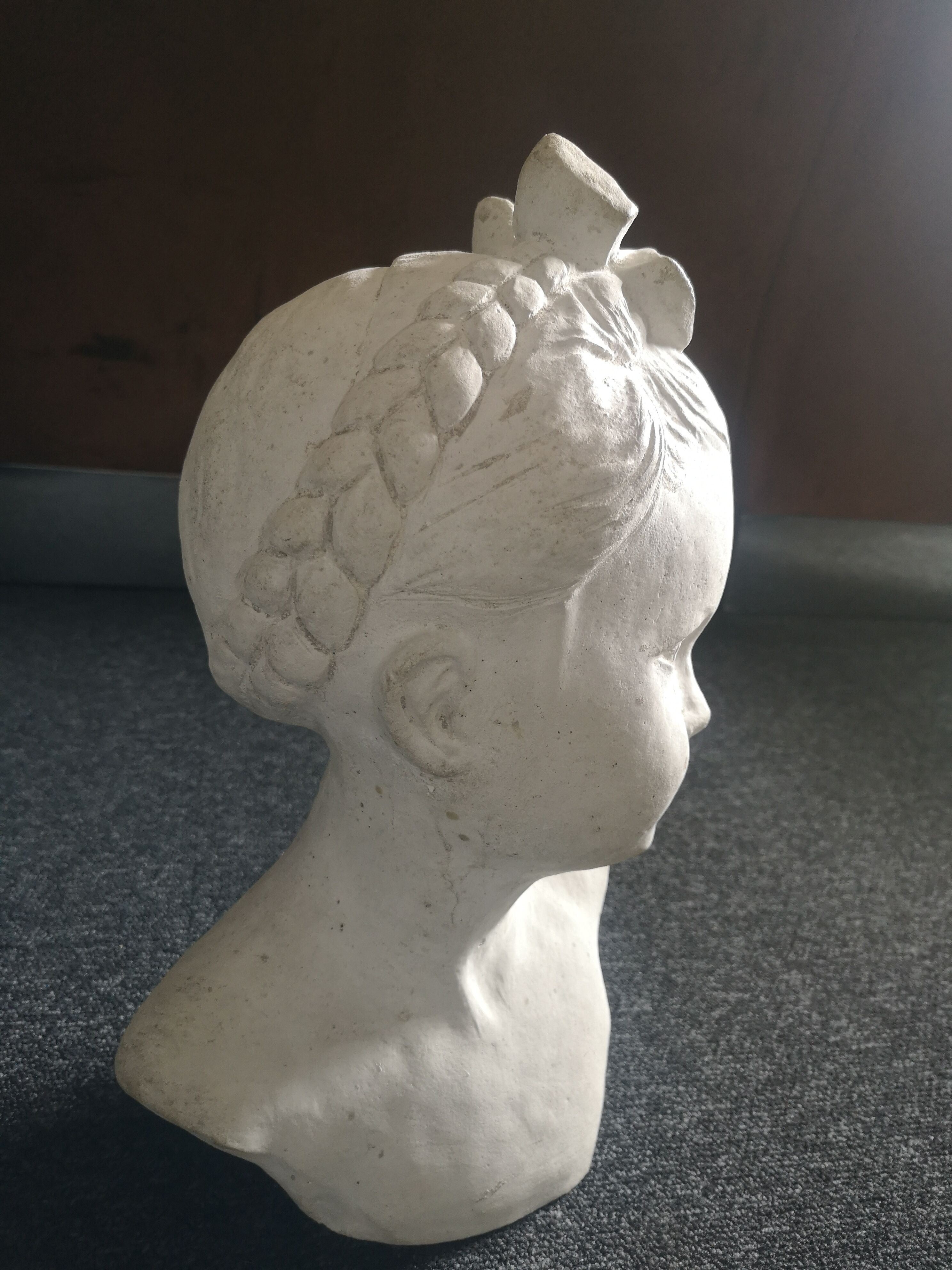 Bust girl in patinated terracotta