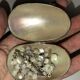 Old mother-of-pearl rosary in its egg box