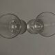 Pair of crystal champagne flutes with a button foot, 1960.