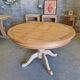 Round cherry table with 2 extensions.