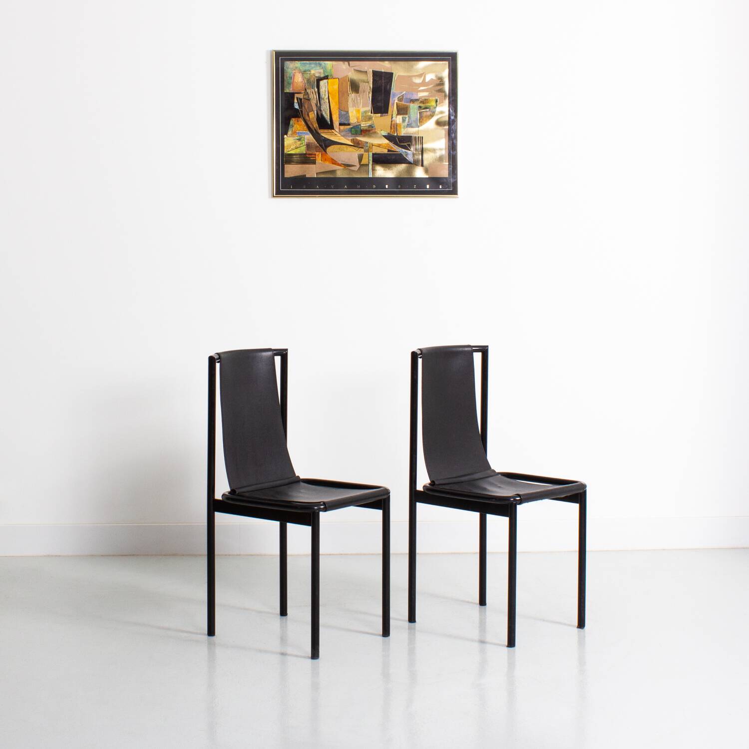 Set of 2 vintage chairs in metal and black imitation leather