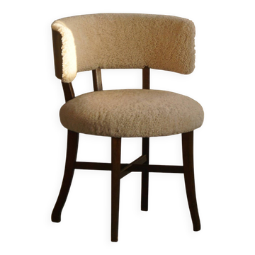 A modern Danish elegant low-back chair, reupholstered in lambswool, 1940s.