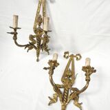 Pair of antique bronze wall lights. Louis style candlestick lamps.