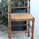 Chaise d’angle ancienne en bois façon bambou assise en paille