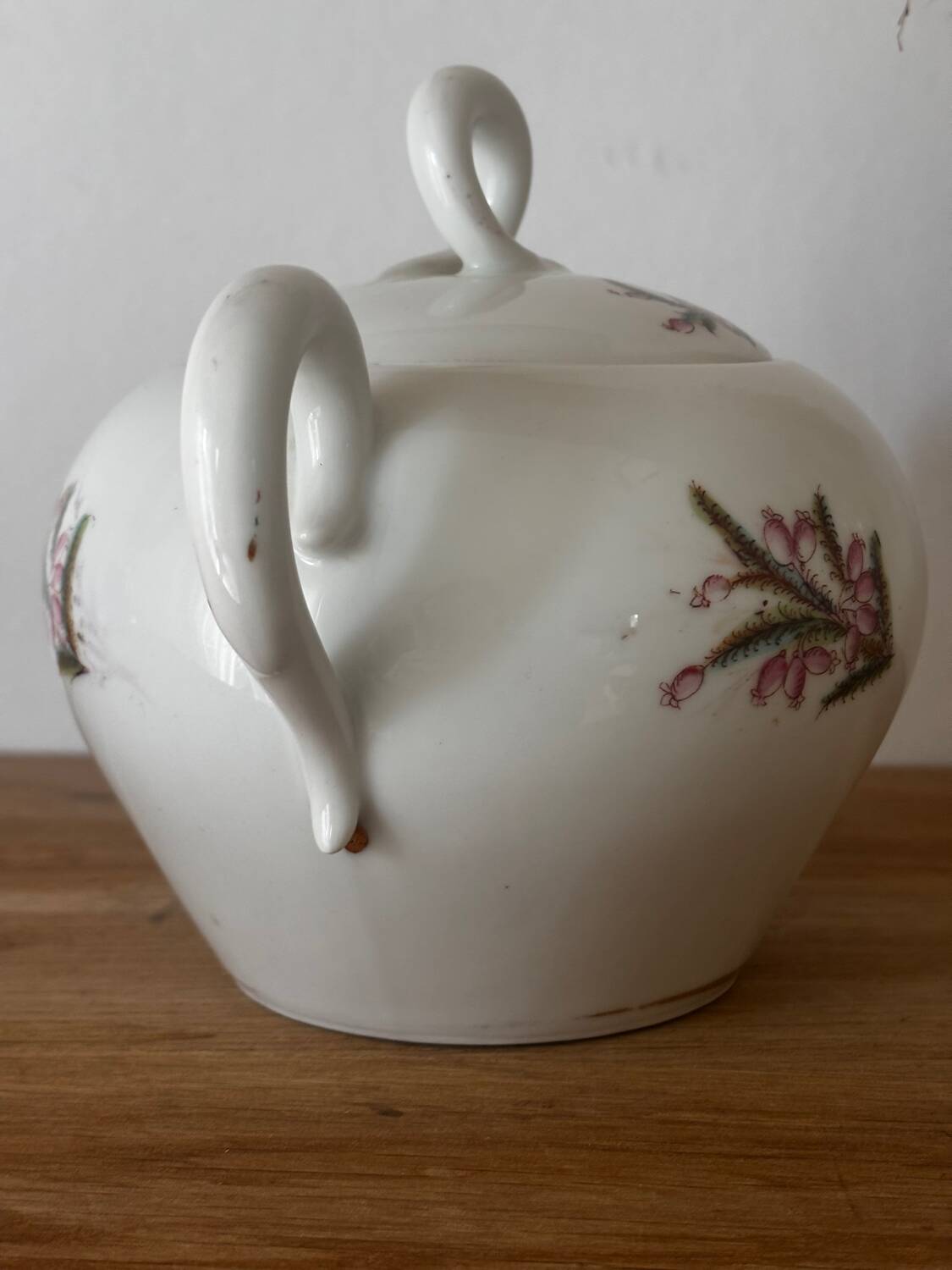 Beautiful vintage porcelain sugar bowl with a floral pattern.