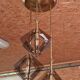 Suspension design in brass and smoked glass
