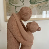 Terracotta sculpture of an entwined couple.