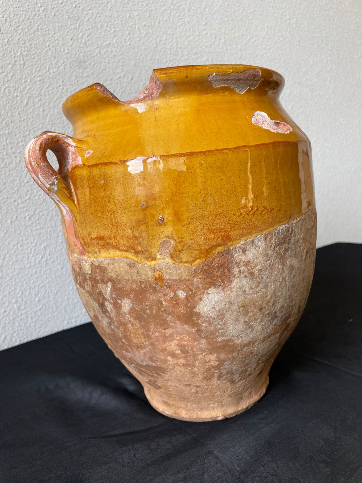 Old grease pot in glazed yellow terracotta, France nineteenth century