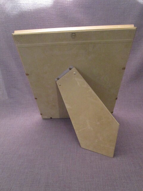 Old wooden and gilded stucco frame