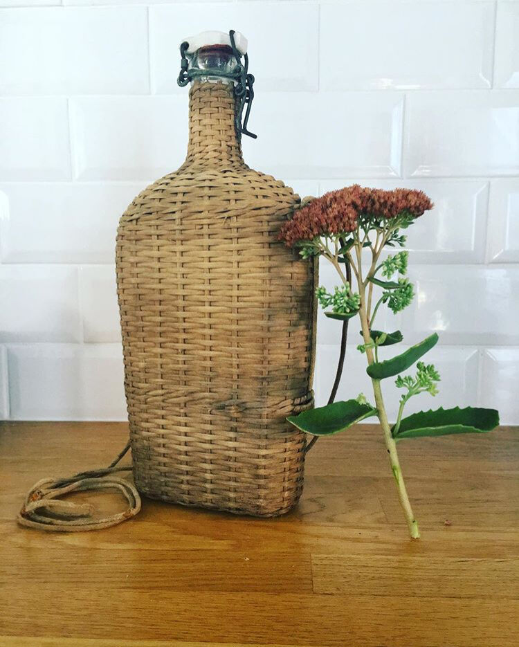 Glass bottle and wicker