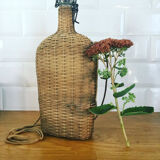 Glass bottle and wicker