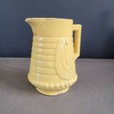 Yellow milk jug with reliefs