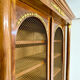 Large Empire-style library in wood with gilded bronze ornaments.