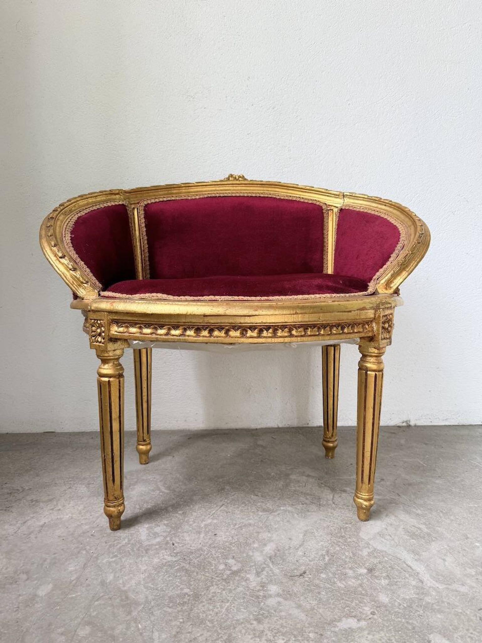 Louis XVI gilt wood and red velvet armchair
