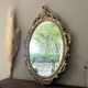 Oval mirror in Baroque style