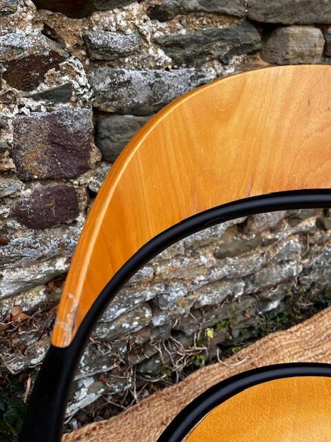 Pair of wooden and black metal chairs
