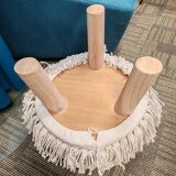 Wood and fabric pouf stool.