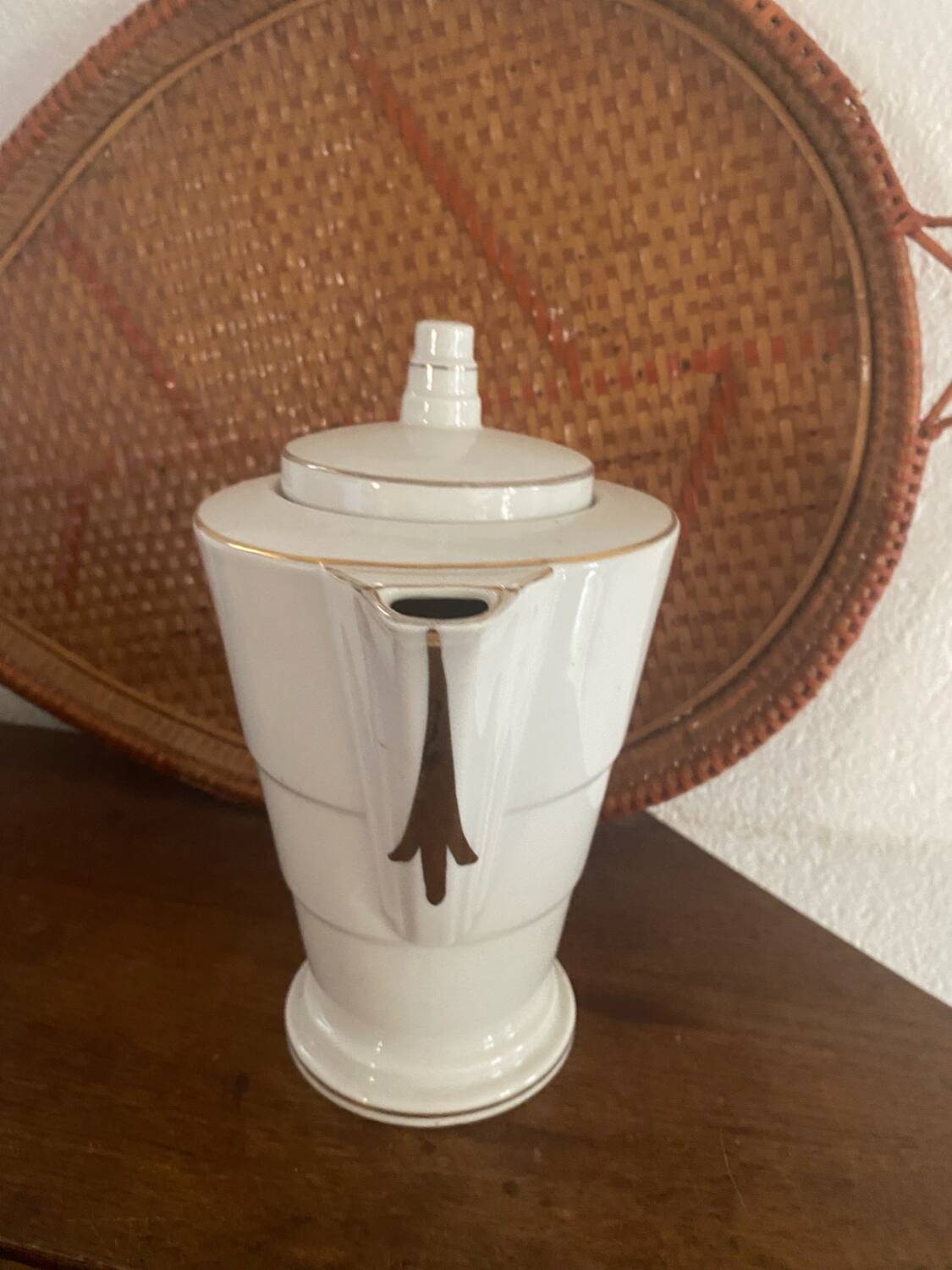 White and gold porcelain coffee pot in art deco style.