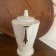 White and gold porcelain coffee pot in art deco style.