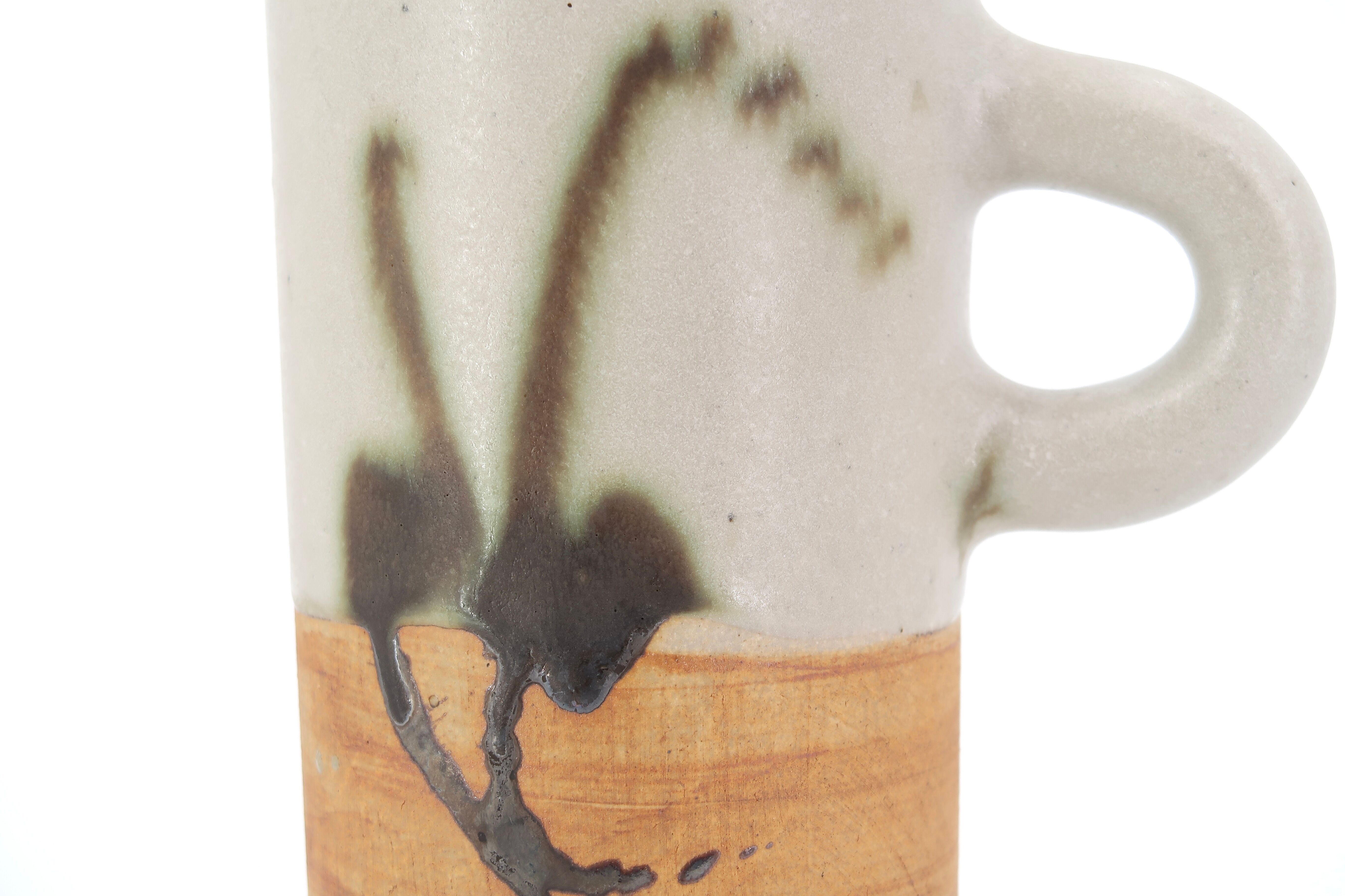 Two ceramic pitchers from the Dove pottery